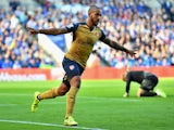 Theo Walcott of Arsenal celebrates scoring his team's first goal during the Barclays Premier League match between Leicester City and Arsenal at The King Power Stadium on September 26, 2015 in Leicester, United Kingdom.