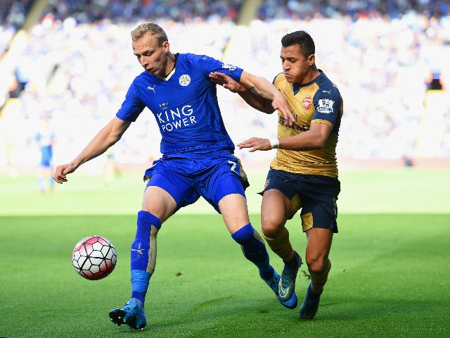 Ritchie De Laet of Leicester City and Alexis Sanchez of Arsenal compete for the ball during the Barclays Premier League match between Leicester City and Arsenal at The King Power Stadium on September 26, 2015 in Leicester, United Kingdom.