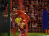 Liverpool's English striker Danny Ings celebrates in the net after scoring the opening goal of the English League Cup third round football match between Liverpool and Carlisle United at Anfield in Liverpool, north west England on September 23, 2015