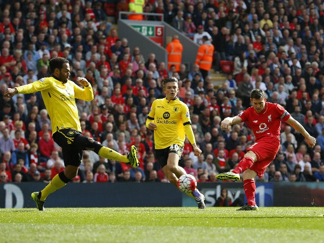 Liverpool's English midfielder James Milner (2nd R) scores his team's first goal during the English Premier League football match between Liverpool and Aston Villa at the Anfield stadium in Liverpool, north-west England, on September 26, 2015.