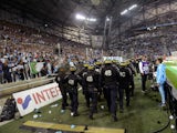 Riot police are pictured during a game interruption after crowd trouble during the French L1 football match Marseille (OM) vs Lyon (OL) on September 20, 2015 at Velodrome Stadium in Marseille, southern France. The match restarted after a 20-minute delay.