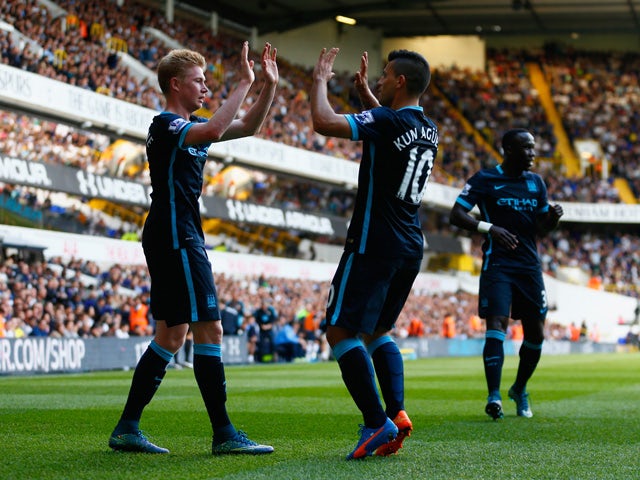 Kevin de Bruyne (L) of Manchester City celebrates scoring his team's first goal with his team mate Sergio Aguero (R) during the Barclays Premier League match between Tottenham Hotspur and Manchester City at White Hart Lane on September 26, 2015