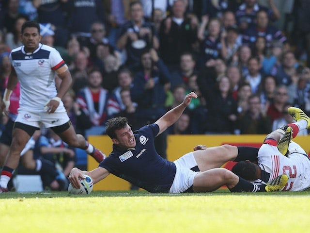 Scotland centre Matt Scott scores his team's third try against USA in a Rugby World Cup Pool B match on September 27, 2015