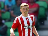 Matt Targett of FC Southampton runs with the ball during the friendly match between FC Groningen and FC Southampton at Euroborg Arena on July 18, 2015 in Groningen, Netherlands.