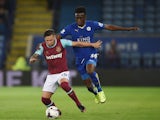 Mauro Zarate of West Ham in action with Joe Dodoo of Leicester during the Capital One Cup Third Round match between Leicester City and West Ham United at The King Power Stadium on September 22, 2015 in Leicester, England.