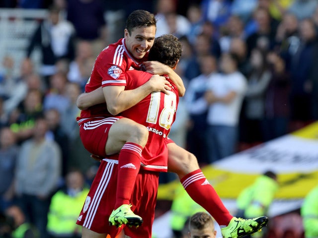 Middlesbrough's Stewart Downing celebrates with Middlesbrough's Christian Stuani after the opening goal during the Sky Bet Championship match between Middlesbrough and Leeds United at the Riverside on September 27, 2015