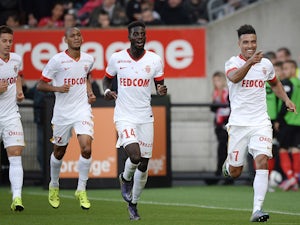 Monaco's Moroccan midfielder Nabil Dirar (R) celebrates after scoring a goal during the French L1 football match between Guingamp and Monaco on September 27, 2015