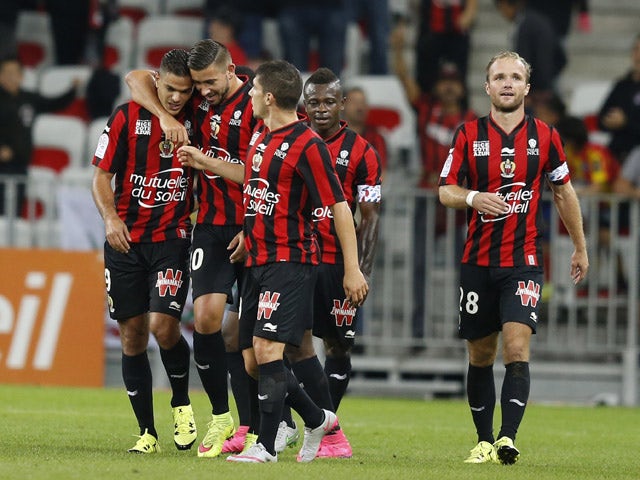 Nice's French forward Hatem Ben Arfa is congratulated by teammates after scoring a goal during the French L1 football match Nice (OGC Nice) vs Bordeaux (GB) on September 23, 2015 