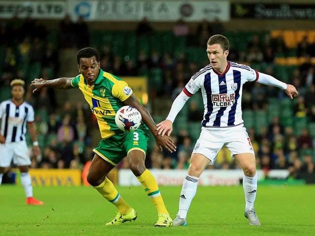 Andre Wisdom of Norwich City and Craig Gardner of West Bromwich Albion compete for the ball during the Capital One Cup Third Round match between Norwich City and West Bromwich Albion at Carrow Road on September 23, 2015