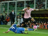 Achraf Lazaar (R) of Palermo jumps as Francesco Manganelli of Sassuolo tackles the Serie A match between US Citta di Palermo and US Sassuolo Calcio at Stadio Renzo Barbera on September 23, 2015