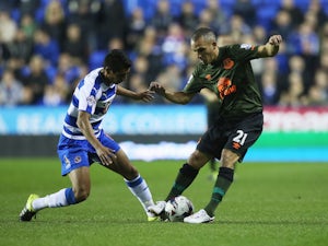 Paolo Hurtado of Reading and Leon Osman of Everton compete for the ball during the Capital One Cup third round match between Reading and Everton at Madejski Stadium on September 22, 2015 in Reading, England.