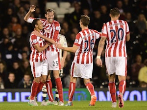  Peter Crouch (2nd L) of Stoke City celebrates after scoring his team's first goal during the Capital One Cup Third Round match between Fulham and Stoke City at Craven Cottage on September 22, 2015 in London, United Kingdom.