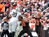 Dan Williams #90 of the Oakland Raiders blocks a pass by Josh McCown #13 in front of Alex Mack #55 of the Cleveland Browns during the first quarter at FirstEnergy Stadium on September 27, 2015 in Cleveland, Ohio. 