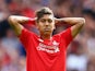 Roberto Firmino of Liverpool rues a missed opportunity during the Barclays Premier League match between Liverpool and West Ham United at Anfield on August 29, 2015