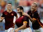 Kostas Manolas (C) of AS Roma celebrates Lucas Digne (L) and Radja Nainngolan after scoring the opening goal during the Serie A match between AS Roma and Carpi FC at Stadio Olimpico on September 26, 2015 in Rome, Italy.