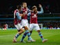 Rudy Gestede of Aston Villa (C) celebrates scoring their first with Jack Grealish and Jordan Amavi of Aston Villa during the Capital One Cup third round match between Aston Villa and Birmingham City at Villa Park on September 22, 2015 in Birmingham, Engla