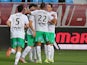 Saint-Etienne's teammates celebrate after Saint-Etienne's French midfielder Benjamin Corgnet scored a goal during the French L1 football match between Troyes and Saint-Etienne on September 23, 2015