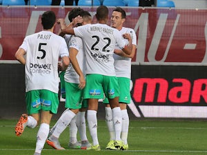 Saint-Etienne's teammates celebrate after Saint-Etienne's French midfielder Benjamin Corgnet scored a goal during the French L1 football match between Troyes and Saint-Etienne on September 23, 2015