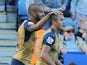 Arsenals English striker Theo Walcott (L) congratulates Arsenals Chilean striker Alexis Sanchez after Sanchez scored his team's second goal during the English Premier League football match between Leicester City and Arsenal at King Power Stadium in Leices