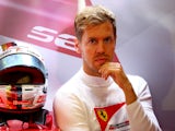 Sebastian Vettel of Germany and Ferrari looks on as he sits in the garage during final practice for the Formula One Grand Prix of Italy at Autodromo di Monza on September 5, 2015