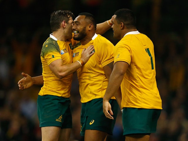 Sekope Kepu of Australia celebrates scoring his teams third try with team mates during the 2015 Rugby World Cup Pool A match between Australia and Fiji at the Millennium Stadium on September 23, 2015