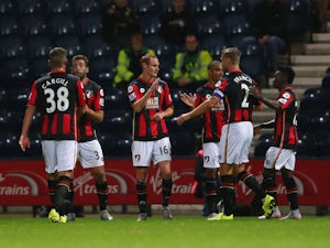 Shaun MacDonald of Bournemouth (16) celebrates with team mates as he scores their first goal during the Capital One Cup third round match between Preston North End and AFC Bournemouth at Deepdale on September 22, 2015 in Preston, England.