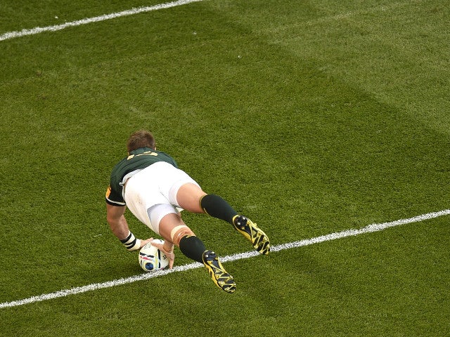 South Africa's centre and captain Jean de Villiers jumps to score his team's second try during the Pool B match of the 2015 Rugby World Cup between South Africa and Samoa at Villa Park in Birmingham, central England, on September 26, 2015.