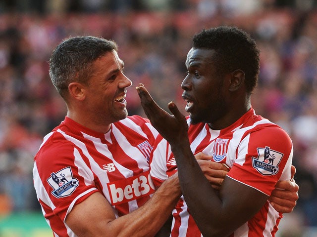 Mame Biram Diouf (L) of Stoke City celebrates scoring his team's second goal with his team mate Jonathan Walters (R) during the Barclays Premier League match between Stoke City and A.F.C. Bournemouth at Britannia Stadium on September 26, 2015