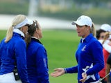 Suzann Pettersen of the European team trying to explain to her captain Carin Koch (l) the length of putt that she did not concede to Alison Lee on the 17th green in her match with Charley Hull (r) against Alison Lee and Brittany Lincicome of the United St