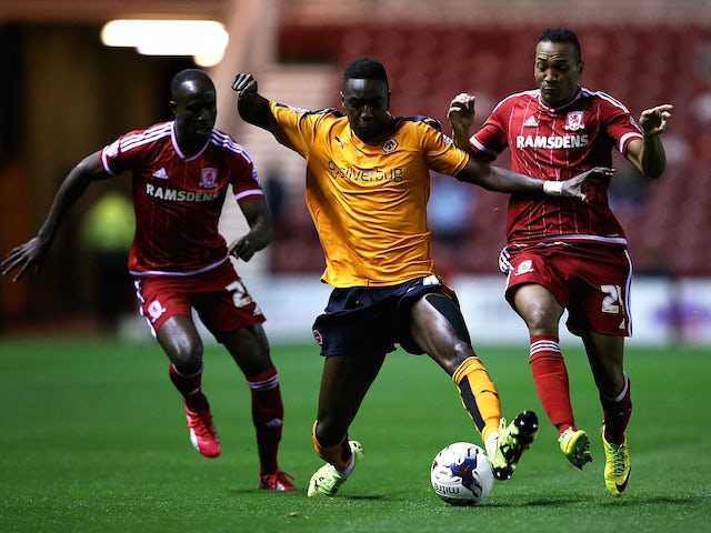 Sylvain Deslandes of Wolverhampton Wanderers battles with Albert Adomah and Emilio Nsue of Middlesbrough during the Capital One Cup third round match between Middlesbrough and Wolverhampton Wanderers at Riverside Stadium on September 22, 2015 in Middlesbr