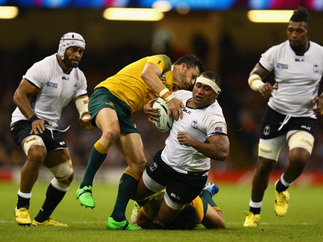 Talemaitoga Tuapati of Fiji is stopped by Adam Ashley-Cooper (L) and Kurtley Beale of Australia during the 2015 Rugby World Cup Pool A match between Australia and Fiji at the Millennium Stadium on September 23, 2015