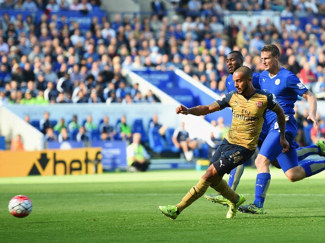 Theo Walcott of Arsenal scores his team's first goal during the Barclays Premier League match between Leicester City and Arsenal at The King Power Stadium on September 26, 2015 in Leicester, United Kingdom. 