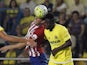 Atletico Madrid's Uruguayan defender Diego Godin (L) vies with Villarreal's Ivorian defender Eric Bally during the Spanish league football match Villarreal CF vs Club Atletico de Madrid at El Madrigal stadium in Villareal on September 26, 2015.