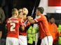 Walsall's English defender James O'Connor (C) celebrates with teammates after scoring their first goal during the English League Cup third round football match between Walsall and Chelsea at The Banks's Stadium in Walsall, central England on September 23,