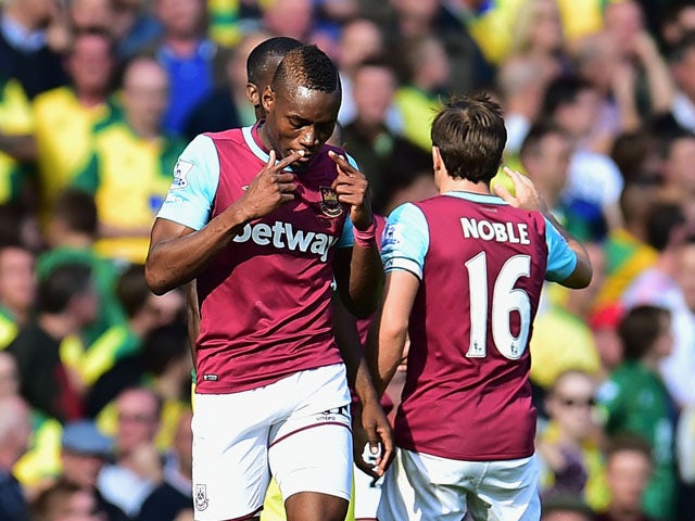 Diafra Sakho (L) of West Ham United celebrates scoring his team's first goal with his team mate Mark Noble (R) during the Barclays Premier League match between West Ham United and Norwich City at the Boleyn Ground on September 26, 2015