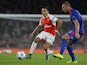 Arsenal's Chilean striker Alexis Sanchez (L) takes on Olympiakos's Swiss midfielder Pajtim Kasami (R) during the UEFA Champions League Group F football match between Arsenal and Olympiakos at The Emirates Stadium in north London on September 29, 2015.