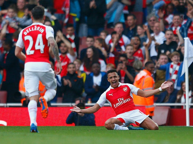 Alexis Sanchez of Arsenal celebrates scoring their third goal during the Barclays Premier League match between Arsenal and Manchester United at Emirates Stadium on October 4, 2015 in London, England.