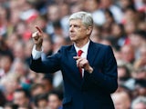 Arsene Wenger manager of Arsenal gestures on the touchline during the Barclays Premier League match between Arsenal and Manchester United at Emirates Stadium on October 4, 2015 in London, England.
