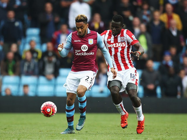 Jordan Amavi of Aston Villa and Mame Biram Diouf of Stoke City compete for the ball during the Barclays Premier League match between Aston Villa and Stoke City at Villa Park on October 3, 2015