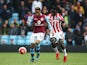 Jordan Amavi of Aston Villa and Mame Biram Diouf of Stoke City compete for the ball during the Barclays Premier League match between Aston Villa and Stoke City at Villa Park on October 3, 2015