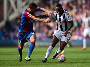 James McArthur of Crystal Palace and Saido Berahino of West Bromwich Albion compete for the ball during the Barclays Premier League match between Crystal Palace and West Bromwich Albion at Selhurst Park on October 3, 2015