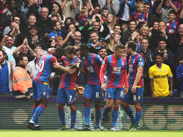 Yannick Bolasie (1st L) of Crystal Palace celebrates scoring his team's first goal with his team mates during the Barclays Premier League match between Crystal Palace and West Bromwich Albion at Selhurst Park on October 3, 2015
