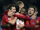 CSKA Moscow's players celebrate a goal during the UEFA Champions League group B football match between CSKA Moscow and PSV Eindhoven at the Khimki Arena outside Moscow on September 30, 2015
