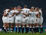 England players huddle prior to the Rugby World Cup match with Australia on October 3, 2015