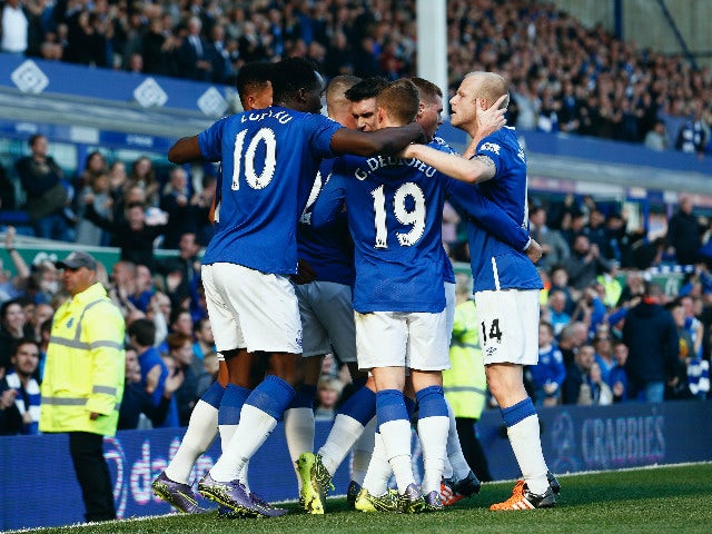 Romelu Lukaku of Everton celebrates with team mates after scoring Everton's first goal during the Barclays Premier League match between Everton and Liverpool at Goodison Park on October 4, 2015 in Liverpool, England.