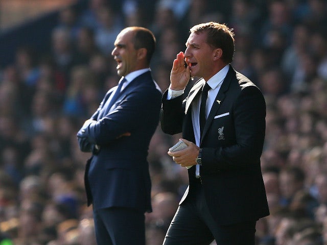 Roberto Martinez manager of Everton and Brendan Rodgers manager of Liverpool on the touchline during the Barclays Premier League match between Everton and Liverpool at Goodison Park on October 4, 2015 in Liverpool, England.