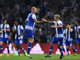 Porto's Brazilian defender Maicon (L) celebrates a goal with Porto's Uruguayan defender Maxi Pereira (R) during the UEFA Champions League Group G football match at the Dragao stadium in Porto on September 29, 2015.