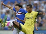 Inter Milan's midfielder from Colombia Fredy Guarin (R) fights for the ball with Sampdoria's midfielder from Paraguay Edgar Barreto during the Italian Serie A football match Sampdoria vs Inter Milan on October 4, 2015 at Luigi Ferraris Stadium in Genoa. 