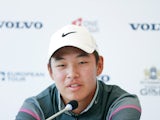 Jin Cheng of China speaks to the media during a news conference during the pro-am prior to the start of the Volvo China Open at Tomson Shanghai Pudong Golf Club on April 22, 2015