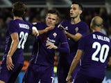 Fiorentina's Slovenian midfielder Josip Ilicic celebrates with teammates after scoring a penalty during the Italian Serie A football match Fiorentina vs Atalanta at the Artemio Franchi Stadium in Florence on October 4, 2015